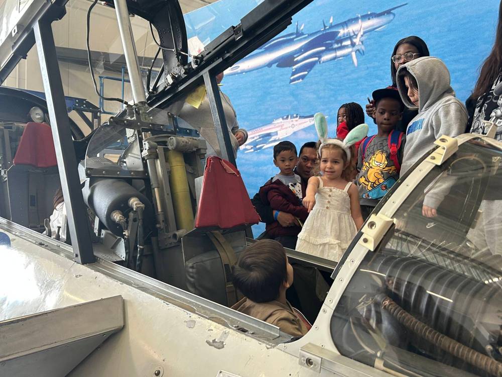 NICOLE BUFFIE / FREE PRESS
                                Children explored historic airplanes and fighter jets while hunting for clues.