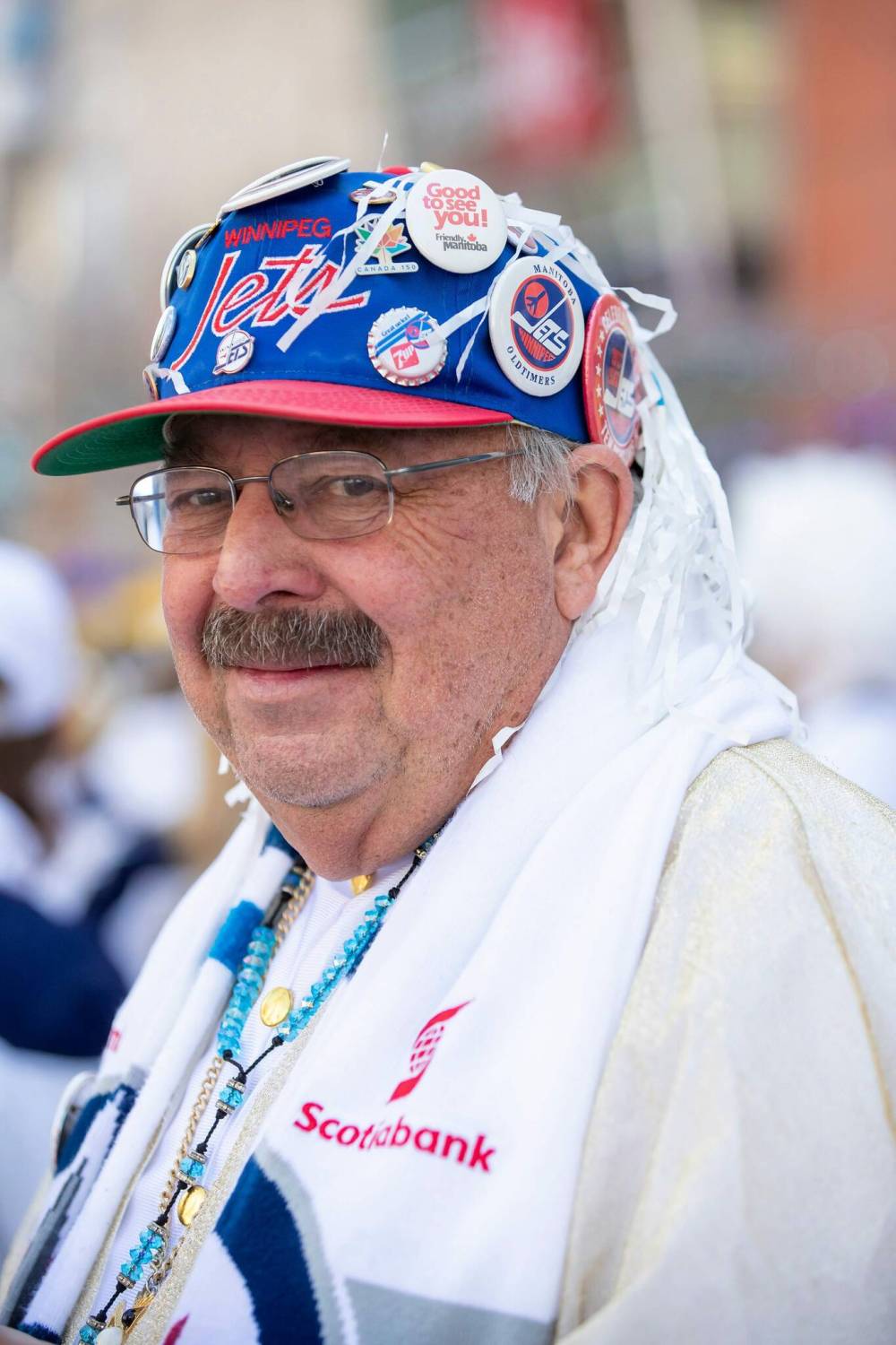 BROOK JONES / FREE PRESS
Winnipeg Jets fan John Couture, 73, shows off his collection of Jets buttons from over the years during Game 1 of the National Hockey League Stanley Cup playoff between the hometown Winnipeg Jets and the visiting St. Louis Blues as he attends the Winnipeg Jets Whiteout party on Donald Street in Winnipeg on Saturday.