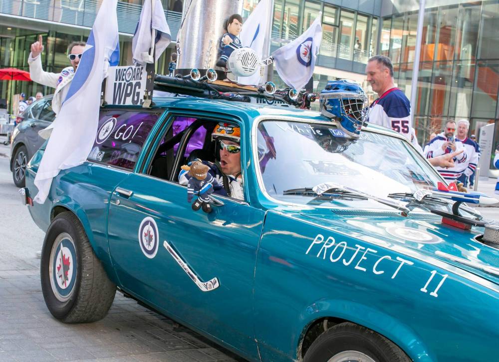 BROOK JONES/FREE PRESS Winnipeg Jets fan Richard Birdsell, 40, is pictured sitting in the passenger seat of a ‘71 Chevrolet Vega wagon just before the start of Game 1 of the National Hockey League Stanley Cup playoff between the hometown Winnipeg Jets and the visiting St. Louis Blues in Winnipeg on Saturday.