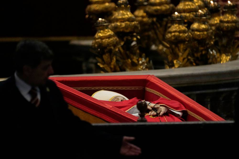 GREGORIO BORGIA / THE ASSOCIATED PRESSThe body of Pope Francis inside St. Peter’s Basilica at the Vatican on Wednesday, where he will lie in state for three days.