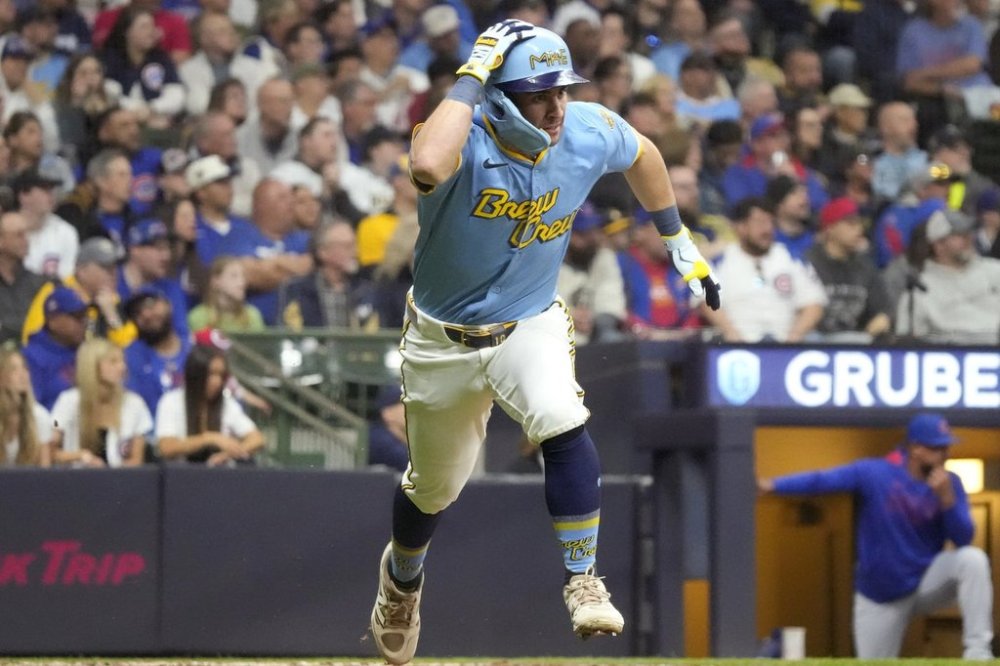Milwaukee Brewers' Sal Frelick runs to first base on a single to shallow center field during the fourth inning of a baseball game against the Chicago Cubs, Friday, May 2, 2025, in Milwaukee. (AP Photo/Kayla Wolf)