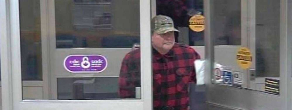 Steve Vogelsang enters an Alberta bank in 2017. (Medicine Hat Police Service)