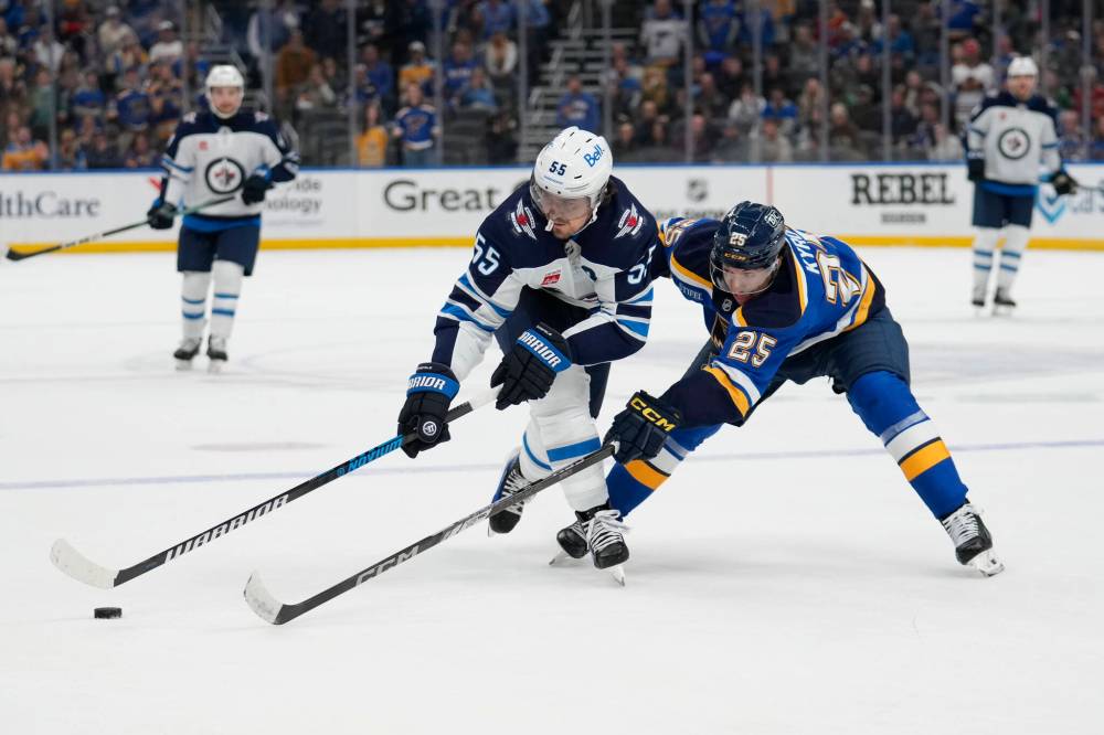 Jeff Roberson / THE ASSOCIATED PRESS FILES
Winnipeg Jets’ Mark Scheifele (left) and St. Louis Blues’ Jordan Kyrou (right) chase after a loose puck during a regular-season Jets road game. Scheifele leads the Jets in post-season points, with two goals and three assists.