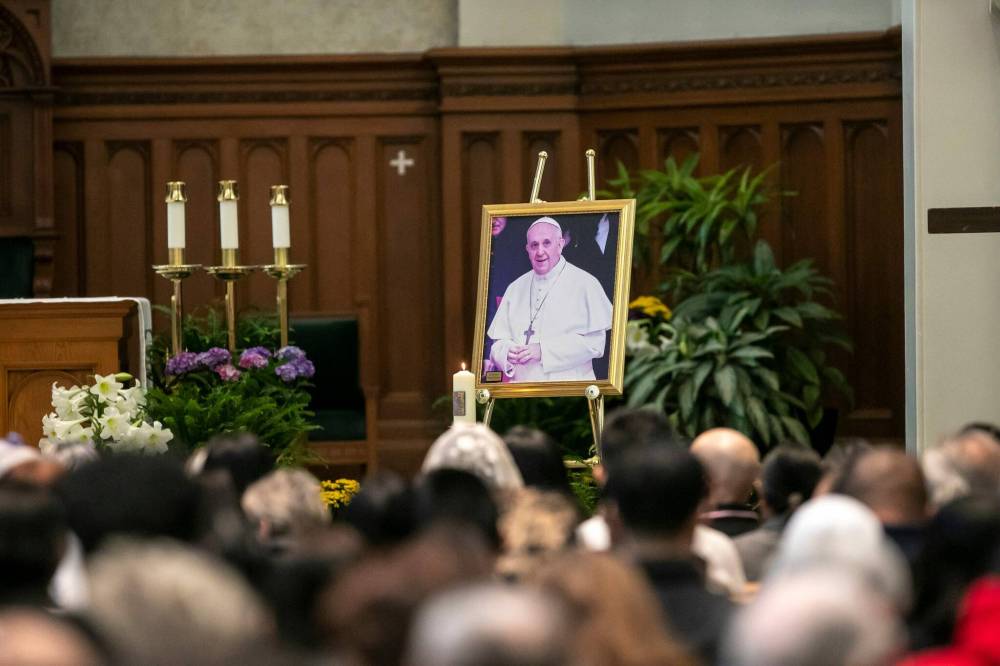 BROOK JONES/FREE PRESS
A portrait of Pope Francis on display at the front of the altar as hundreds of people attend a memorial mass at St. Mary’s Cathedral Church, Wednesday.