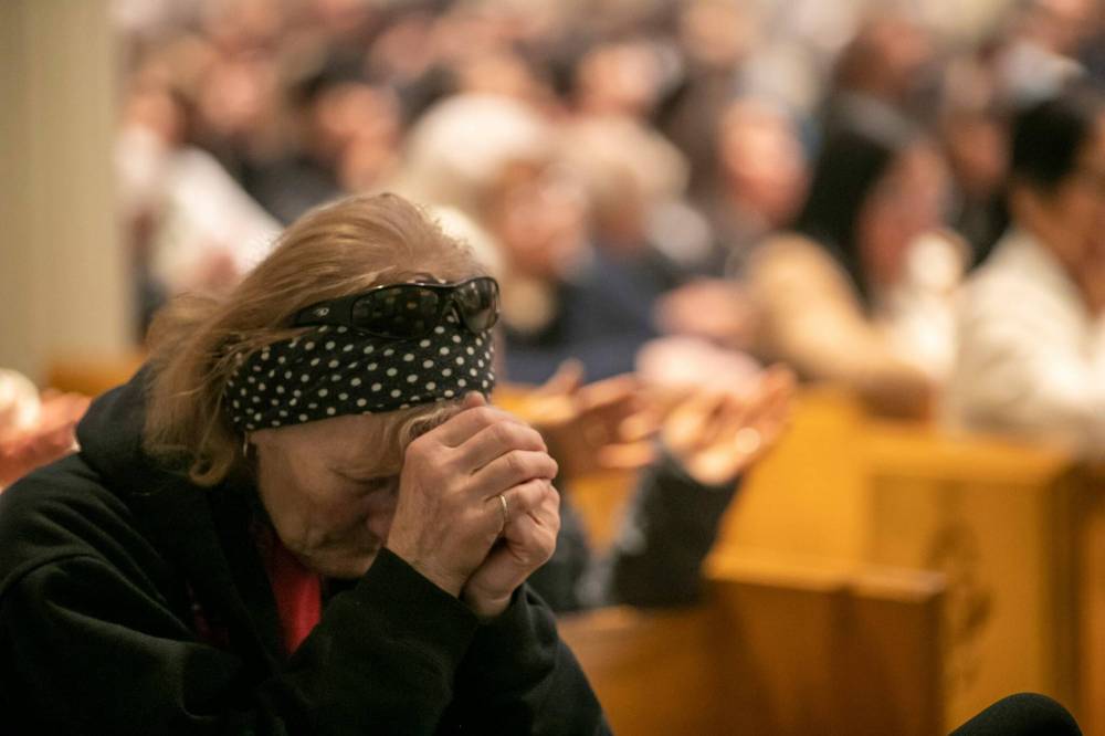BROOK JONES / FREE PRESS
For Catholics, the mass was a chance to pray for a Pope widely regarded for his acceptance of all people.