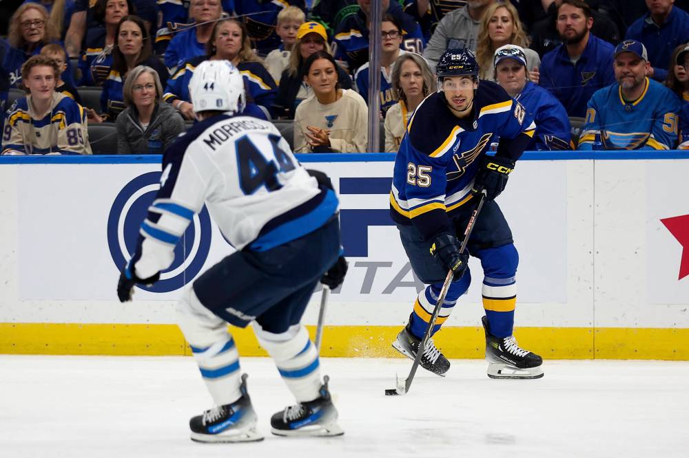 Scott Kane / The Associated Press
St. Louis Blues’ Jordan Kyrou controls the puck as Winnipeg Jets’ Josh Morrissey defends during the second period.