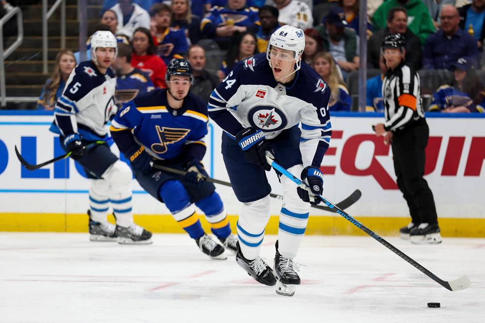 Scott Kane / The Associated Press
Winnipeg Jets’ Logan Stanley looks to pass the puck during the second period.