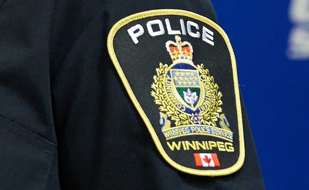 A Winnipeg Police Service shoulder badge is seen at a press conference in Winnipeg on Sept. 2, 2021. THE CANADIAN PRESS/David Lipnowski