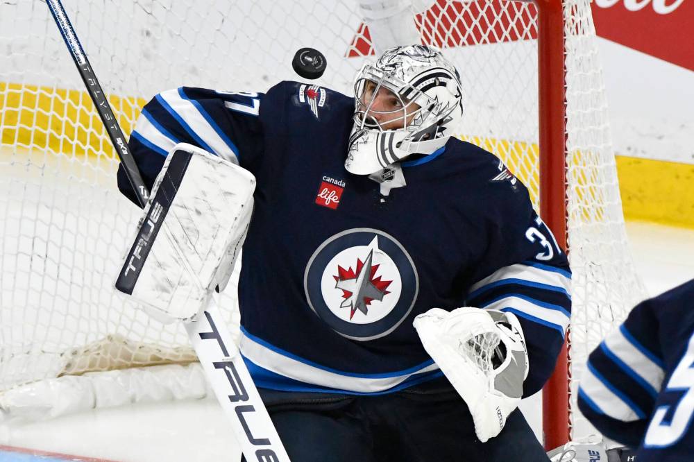 Fred Greenslade / THE CANADIAN PRESS
Winnipeg Jets goaltender Connor Hellebuyck makes a save on the St. Louis Blues at Canada life Centre.