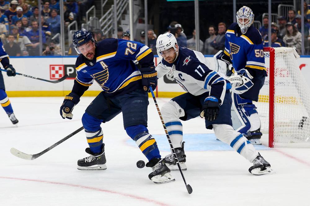 Scott Kane / THE ASSOCIATED PRESS
Winnipeg Jets captain Adam Lowry (centre) says the Jets want to get back to their style of play after dropping two games on the road in St. Louis.