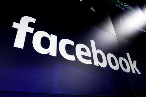 FILE - The logo for Facebook appears on screens in New York's Times Square on March 29, 2018. (AP Photo/Richard Drew, File)