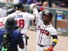 Atlanta Braves' Matt Olson (28) celebrates his two-run home run against the Minnesota Twins with teammate Ozzie Albies (1) during the first inning of a baseball game Saturday, April 20, 2025, in Atlanta. (AP Photo/John David Mercer)