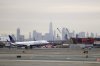 FILE - A United Airlines jet prepares touches down at Newark Liberty International Airport a day after a temporary grounding of aircraft was placed after reports of drones in the flight path, Wednesday, Jan. 23, 2019, in Newark, N.J. (AP Photo/Julio Cortez, File)