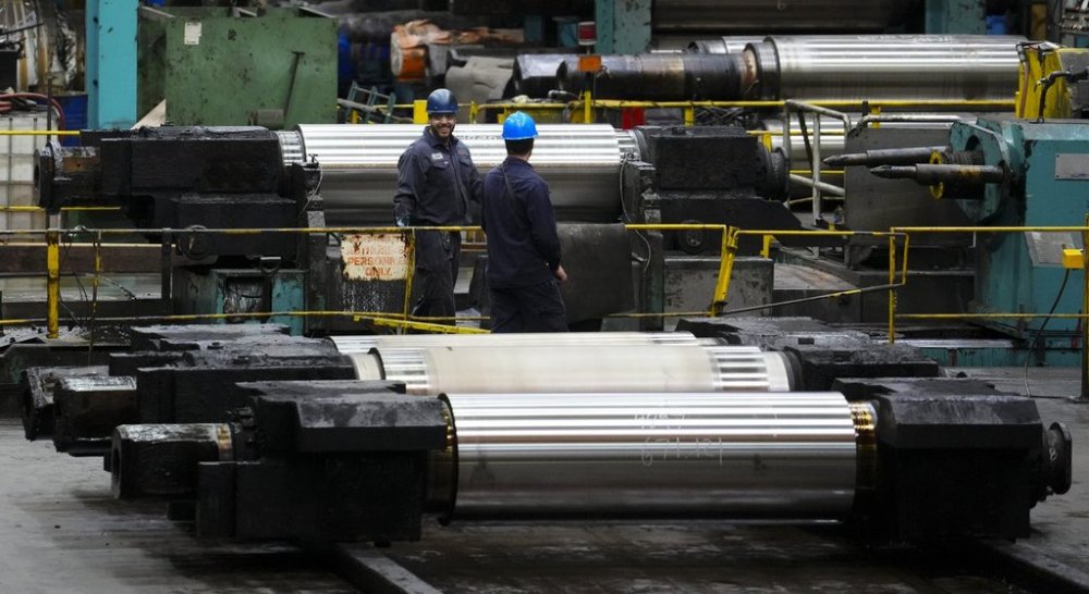 Machinery and workers are seen at Algoma Steel Inc., in Sault Ste. Marie, Ont., Friday, April 25, 2025. THE CANADIAN PRESS/Sean Kilpatrick