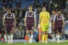 Aston Villa players react disappointed after the English Premier League soccer match between Manchester City and Aston Villa at Etihad stadium in Manchester, England, Tuesday, April 22, 2025. (AP Photo/Jon Super)