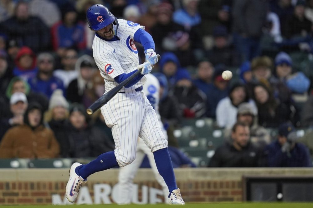 Chicago Cubs' Dansby Swanson (7) hits a home run during the second inning of a baseball game against the Texas Rangers, Tuesday, April 8, 2025, in Chicago. (AP Photo/Erin Hooley)