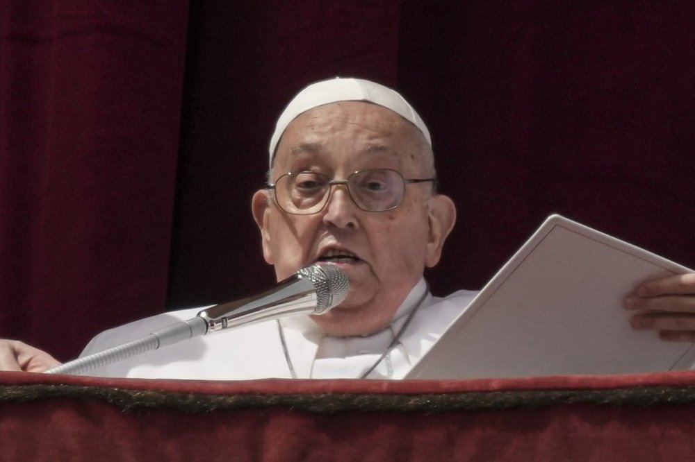 Pope Francis appears on the central lodge of St. Peter's Basilica to bestow the Urbi et Orbi (Latin for to the city and the world) blessing at the end of the Easter mass presided over by Cardinal Angelo Comastri in St. Peter's Square at the Vatican Sunday, April 20, 2025. (AP Photo/Andrew Medichini)