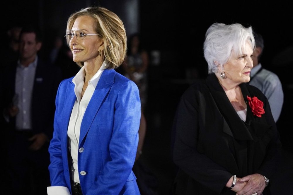 FILE - Republican candidates for Arizona governor Karrin Taylor Robson, left, and Paola Tulliani-Zen, right, arrive on the set prior to a PBS televised debate, on June 29, 2022, in Phoenix. (AP Photo/Ross D. Franklin, File)
