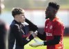 Manchester United's Alejandro Garnacho and goalkeeper Andre Onana attend a training session ahead of the Europa League quarterfinal first leg soccer match against Lyon, at Trafford Training Centre, Carrington, England, Wednesday, April 9, 2025. (Martin Rickett/PA via AP)