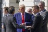 President Donald Trump talks with Laurens Vanthoor and Felipe Nasr, left, during an event with auto racing champions at the South Portico of the White House Wednesday, April 9, 2025, in Washington, (Pool via AP)