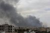 Smoke billows following Israeli airstrikes targeting a power plant and Sanaa Airport, in Sanaa, Yemen, Tuesday, May 6, 2025. (AP Photo/Osamah Abdulrahman)