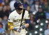 Milwaukee Brewers' Christian Yelich watches his home run against the Detroit Tigers during the third inning of a baseball game, Wednesday, April 16, 2025, in Milwaukee. (AP Photo/Jeffrey Phelps)