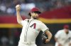 Arizona Diamondbacks starting pitcher Zac Gallen throws against the New York Mets during the first inning of a baseball game Tuesday, May 6, 2025, in Phoenix. (AP Photo/Ross D. Franklin)