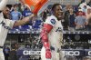 Miami Marlins catcher Agustín Ramírez (50) pours ice water on Jesús Sánchez after he hit a walk off single during the 10 inning of baseball game against the Los Angeles Dodgers, Tuesday, May 6, 2025, in Miami. (AP Photo/Marta Lavandier)