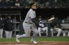 Athletics' Gio Urshela (13) watches his two-RBI triple during the sixth inning of a baseball game against the Chicago White Sox, Wednesday, April 16, 2025, in Chicago. (AP Photo/Paul Beaty)