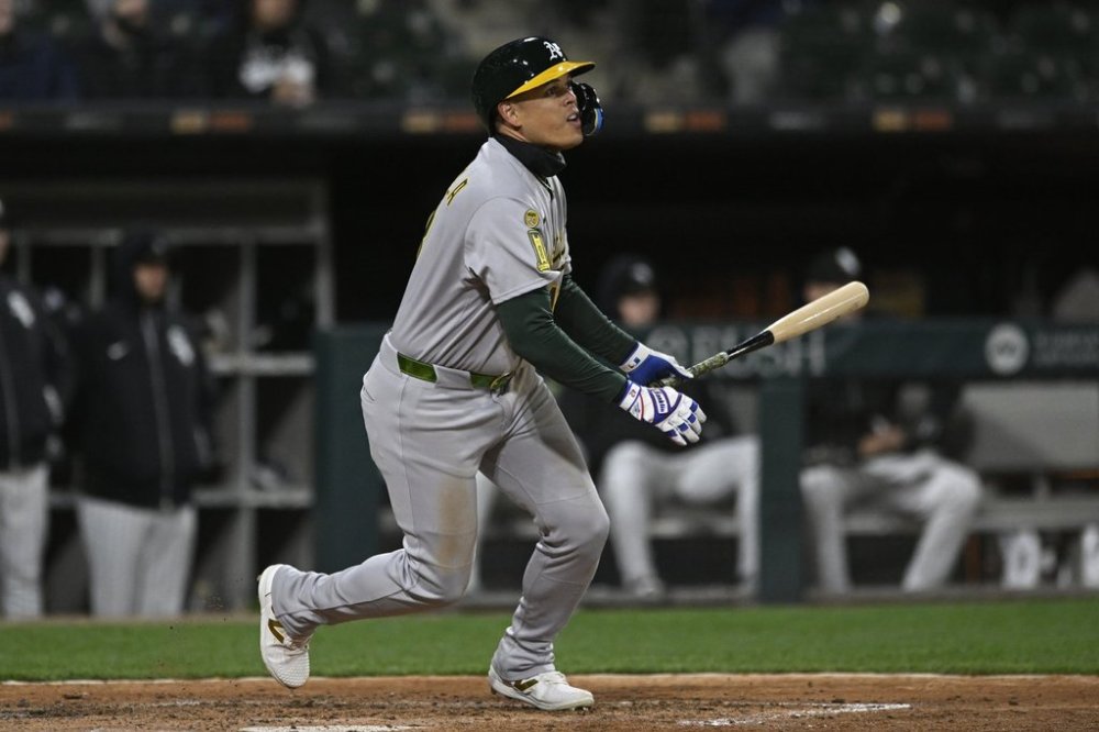 Athletics' Gio Urshela (13) watches his two-RBI triple during the sixth inning of a baseball game against the Chicago White Sox, Wednesday, April 16, 2025, in Chicago. (AP Photo/Paul Beaty)