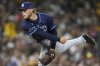 Tampa Bay Rays starting pitcher Shane Baz works against a San Diego Padres batter during the fifth inning of a baseball game Friday, April 25, 2025, in San Diego. (AP Photo/Gregory Bull)