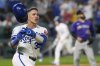 Kansas City Royals' Freddy Fermin (34) runs to first after hitting a walk-off single in the 11th inning to win a baseball game against the Colorado Rockies, Tuesday, April 22, 2025, in Kansas City, Mo. (AP Photo/Charlie Riedel)