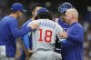 Chicago Cubs pitcher Shota Imanaga (18) is consoled after getting injured during the sixth inning of a baseball game against the Milwaukee Brewers, Sunday, May 4, 2025, in Milwaukee. (AP Photo/Jeffrey Phelps)