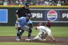 Arizona Diamondbacks' Corbin Carroll (7) steals second base under a tag by Tampa Bay Rays shortstop José Caballero, front left, in the first inning during a baseball game, Thursday, April 24, 2025, in Phoenix. (AP Photo/Rick Scuteri)