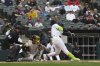 Chicago White Sox's Edgar Quero hits a single during the sixth inning of a baseball game against the Milwaukee Brewers in Chicago, Thursday, May 1, 2025. (AP Photo/Nam Y. Huh)