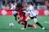 Canada's Deanne Rose, back left, and Argentina's Aldana Cometti vie for the ball during the first half of an international friendly soccer match, in Langford, B.C., on Tuesday, April 8, 2025. THE CANADIAN PRESS/Darryl Dyck