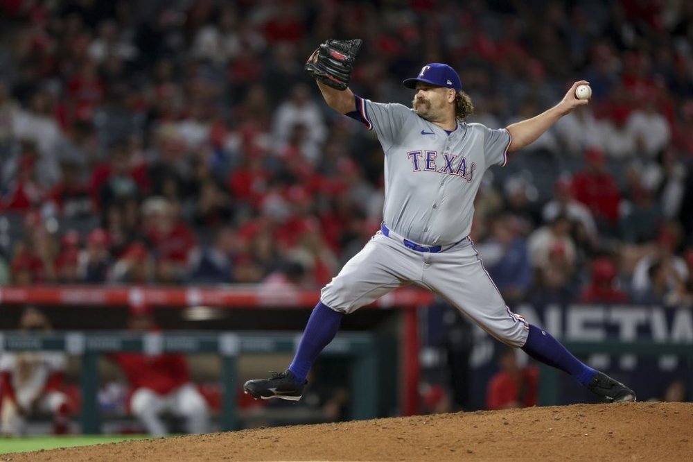 FILE - Texas Rangers relief pitcher Andrew Chafin throws during the seventh inning of a baseball game against the Los Angeles Angels, Friday, Sept. 27, 2024, in Anaheim, Calif. (AP Photo/Ryan Sun, File)