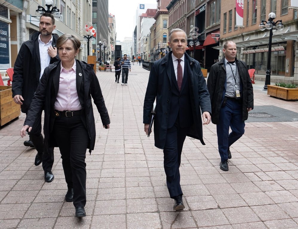 Prime Minister Mark Carney walks to his first news conference after winning the federal election in Ottawa on Friday, May 2, 2025. THE CANADIAN PRESS/Adrian Wyld