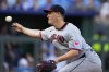 FILE - Cleveland Guardians relief pitcher Paul Sewald throws during the 10th inning of a baseball game against the Kansas City Royals, March 27, 2025, in Kansas City, Mo. (AP Photo/Charlie Riedel, File)