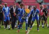 Peterborough United's Harley Mills with the trophy after winning the Vertu Trophy Final at Wembley Stadium, London, Sunday April 13, 2025. (Bradley Collyer/PA via AP)