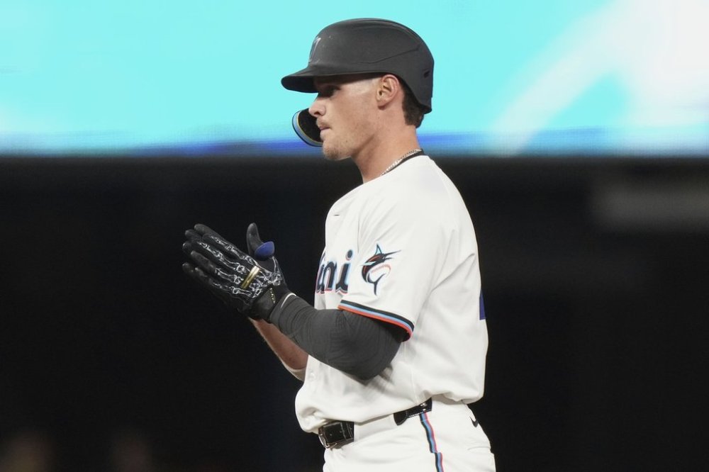 Miami Marlins' Griffin Conine reacts after hitting a double during the seventh inning of a baseball game against the Arizona Diamondbacks, Tuesday, April 15, 2025, in Miami. (AP Photo/Lynne Sladky)