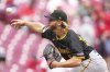 Pittsburgh Pirates pitcher Carmen Mlodzinski throws during the first inning of a baseball game against the Cincinnati Reds, Sunday, April 13, 2025, in Cincinnati. (AP Photo/Jeff Dean)