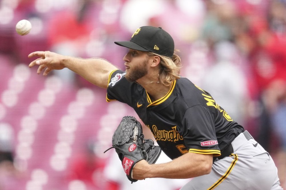 Pittsburgh Pirates pitcher Carmen Mlodzinski throws during the first inning of a baseball game against the Cincinnati Reds, Sunday, April 13, 2025, in Cincinnati. (AP Photo/Jeff Dean)