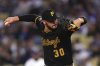 Pittsburgh Pirates starting pitcher Paul Skenes throws to the plate during the first inning of a baseball game against the Los Angeles Dodgers, Friday, April 25, 2025, in Los Angeles. (AP Photo/Mark J. Terrill)