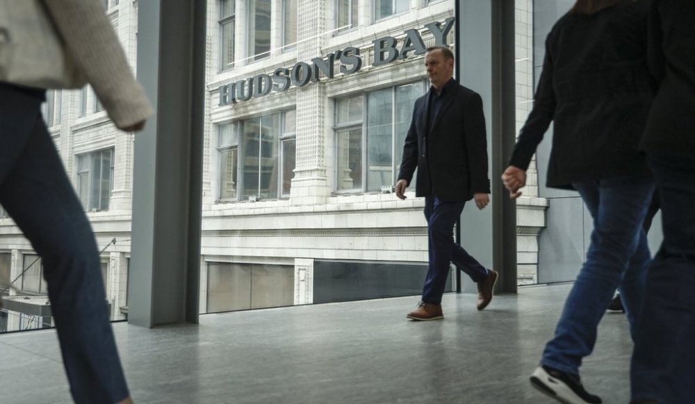 Pedestrians pass the Hudson's Bay store in downtown Calgary, Alta., Thursday, March 20, 2025. THE CANADIAN PRESS/Jeff McIntosh