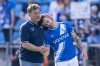 Bochum's head coach Dieter Hecking, left, comforts Bochum's Tom Krauß, right, after the German Bundesliga soccer match between VfL Bochum and 1. FC Union Berlin in Bochum, Germany, Sunday, April 27, 2025. (David Inderlied/dpa via AP)
