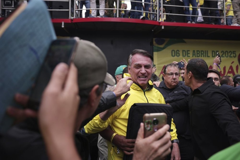 Former President Jair Bolsonaro arrives at a demonstration demanding amnesty for those arrested for 2023's alleged coup attempt, in Sao Paulo, Sunday, April 6, 2025. (AP Photo/Ettore Chiereguini)