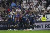 FILE - Strasbourg players celebrate after Strasbourg's Emanuel Emegha scored his side's third goal during the French League One soccer match between Lyon and Strasbourg at the Groupama stadium in Decines, outside Lyon, France, Friday, Aug. 30, 2024. (AP Photo/Laurent Cipriani, file)