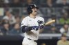 New York Yankees' Austin Wells follows through on a grand slam during the seventh inning of a baseball game against the San Diego Padres Tuesday, May 6, 2025, in New York. (AP Photo/Frank Franklin II)