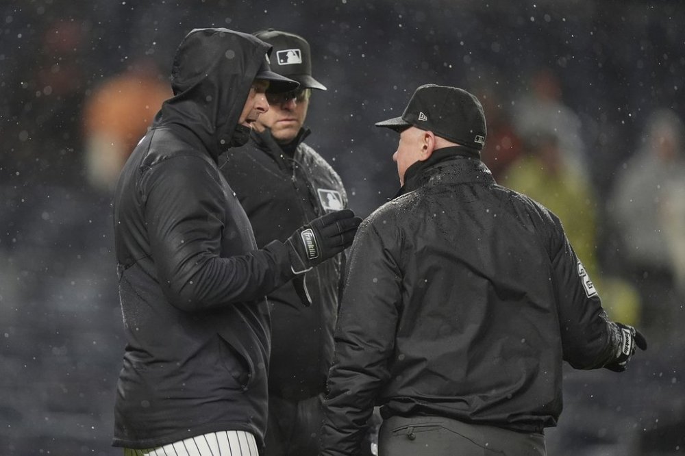 New York Yankees manager Aaron Boone talks to umpire Lance Barksdale during the sixth inning of a baseball game against the San Francisco Giants Friday, April 11, 2025, in New York. (AP Photo/Frank Franklin II)
